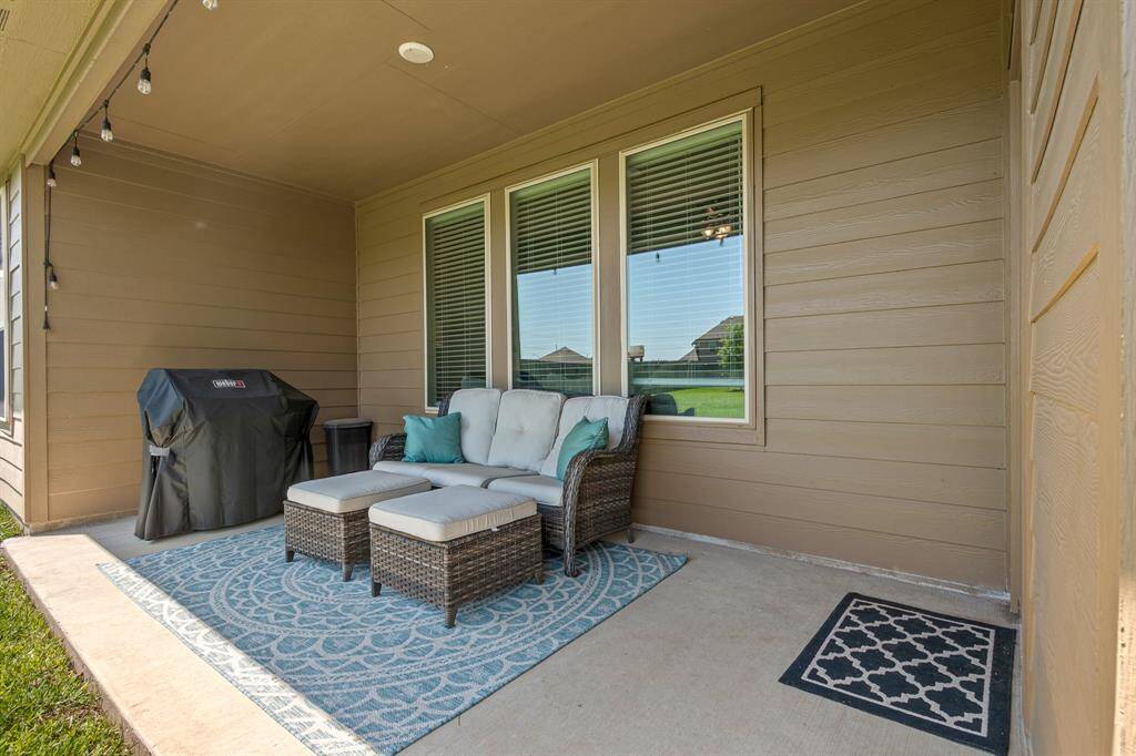 Spacious covered patio perfect for entertaining guests.