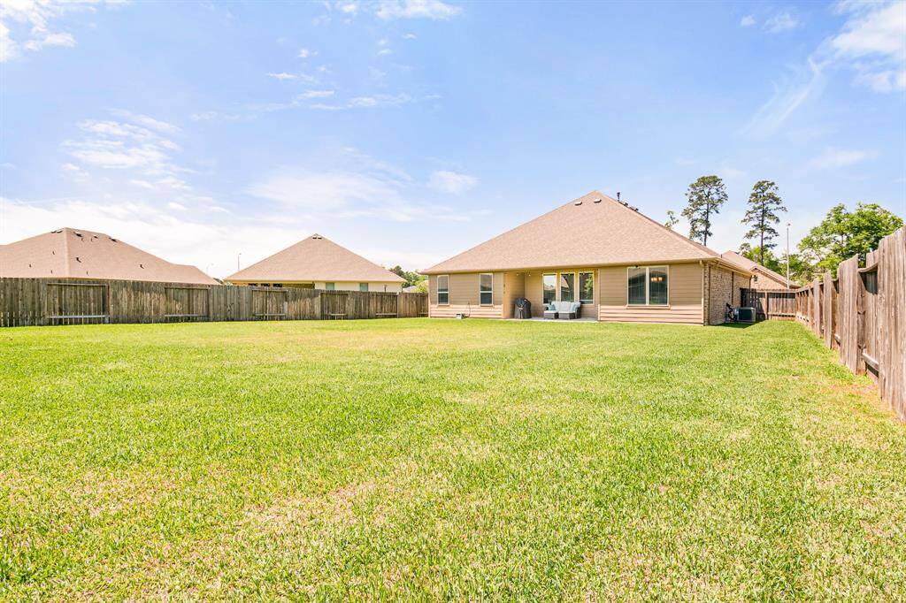 Expansive backyard perfect for relaxation and outdoor activities.