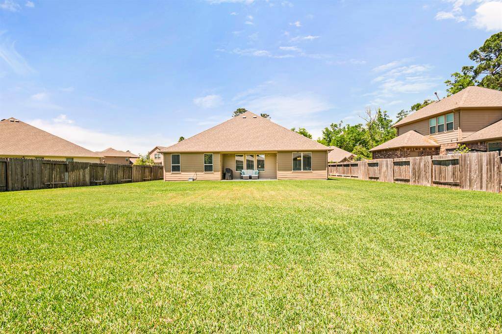 Expansive backyard perfect for relaxation and entertainment.