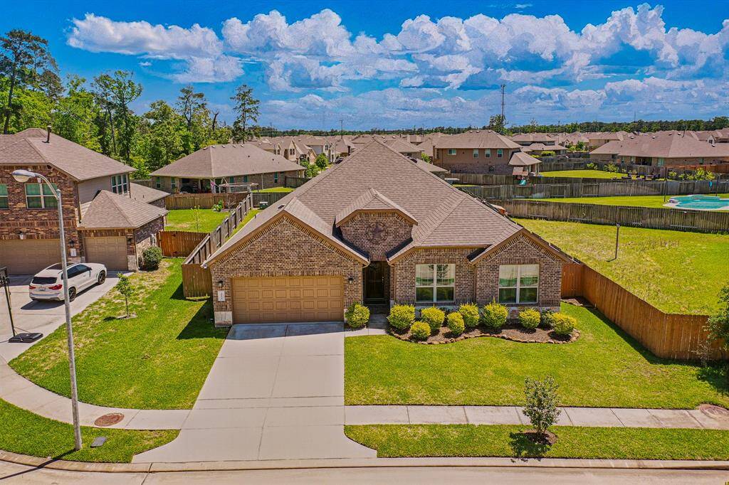 Stunning aerial view showcasing the home's spacious layout and beautiful surroundings.