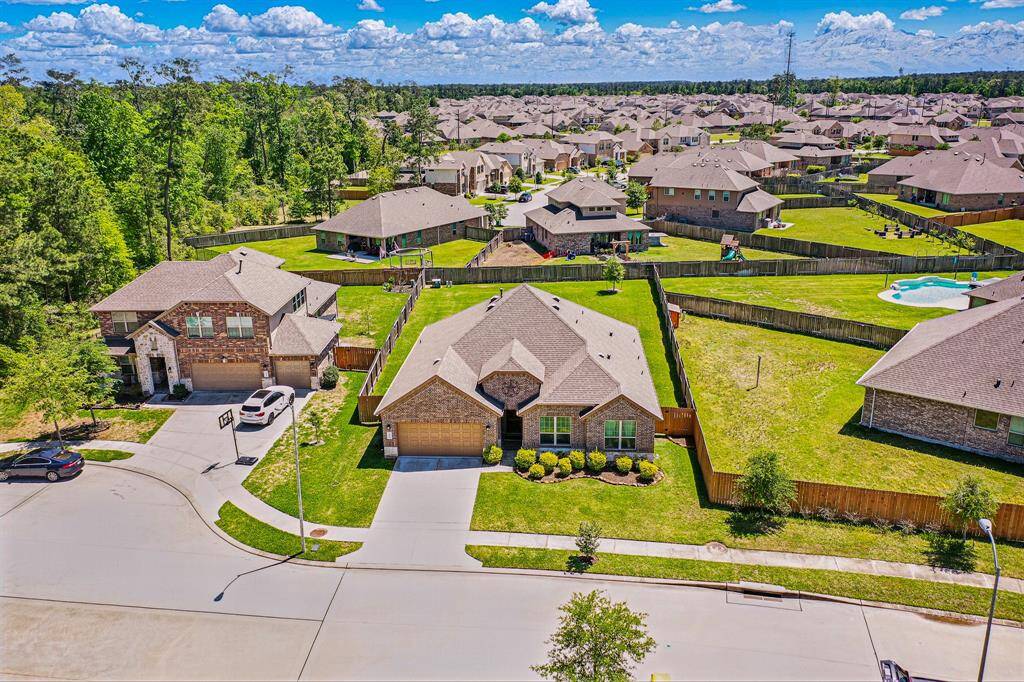 A stunning aerial view showcases the home's spacious layout and serene surroundings.