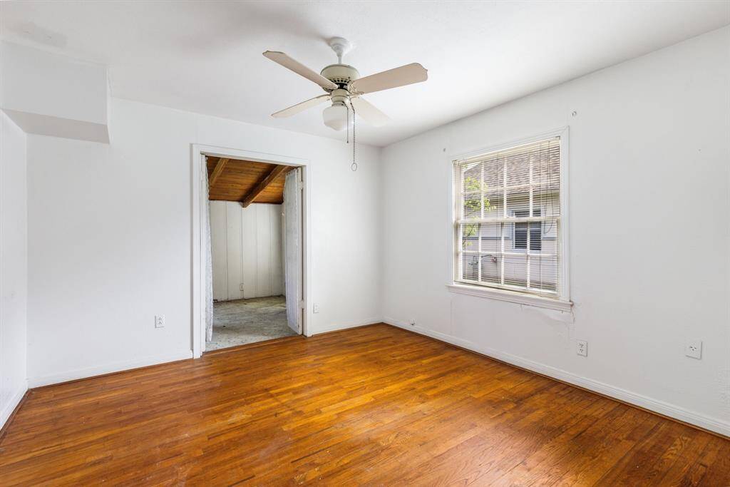 Second bedroom with French doors leading to the sunroom.