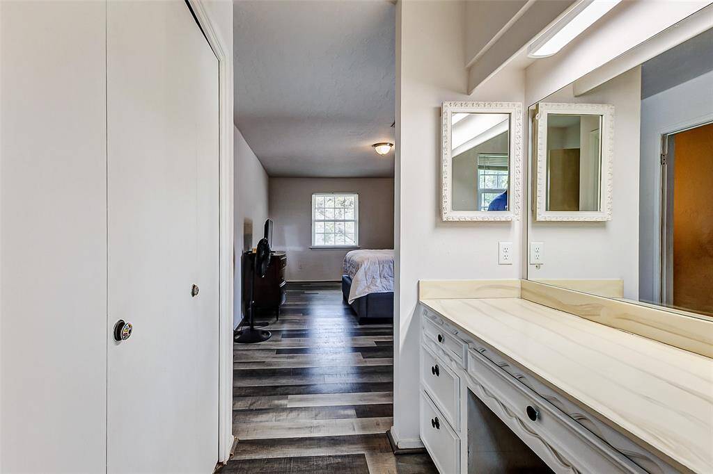 Additional features include a convenient closet, a medicine cabinet, and, not shown, a tub/shower combination, offering both comfort and practicality.