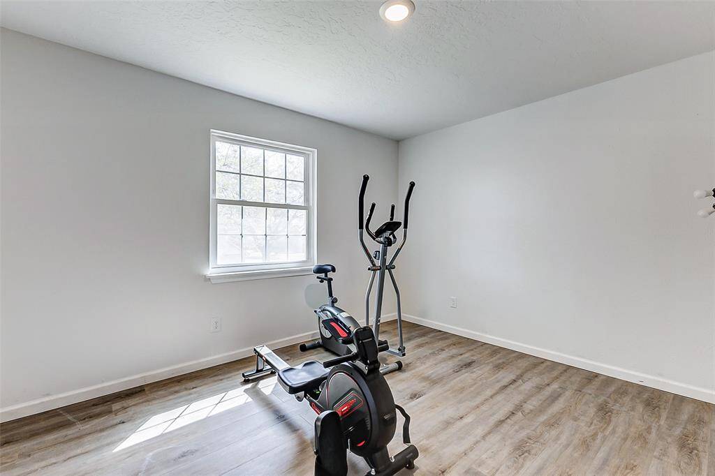 This secondary room offers plenty of space foryour guests to relax and unwind, witha large window that fills the spacewith natural light. You also have updated flooring!