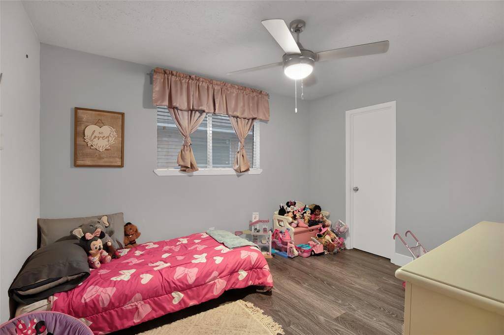 Front office room with an exposed brick wall for a unique touch of style. (Currently being used a bedroom)