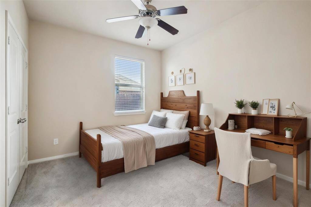 One of the downstairs secondary bedroom. [virtually staged]