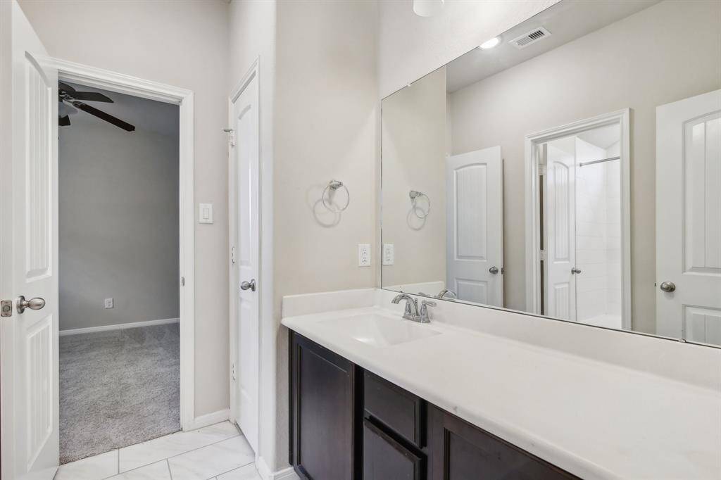 Full Jack and Jill between the two downstairs secondary bedrooms.