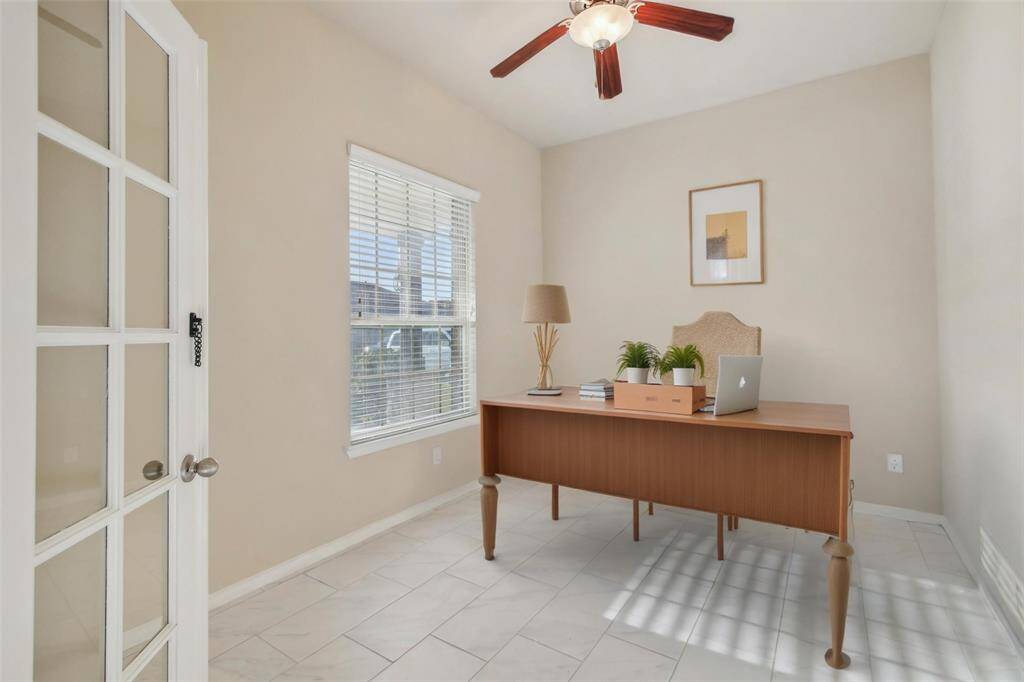 Office/Study upon entry of the home. [virtually staged]