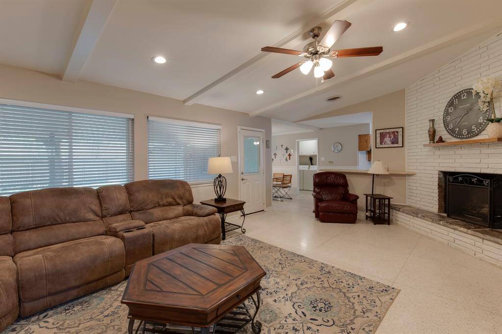 Family room has door that leads to the covered patio and backyard.