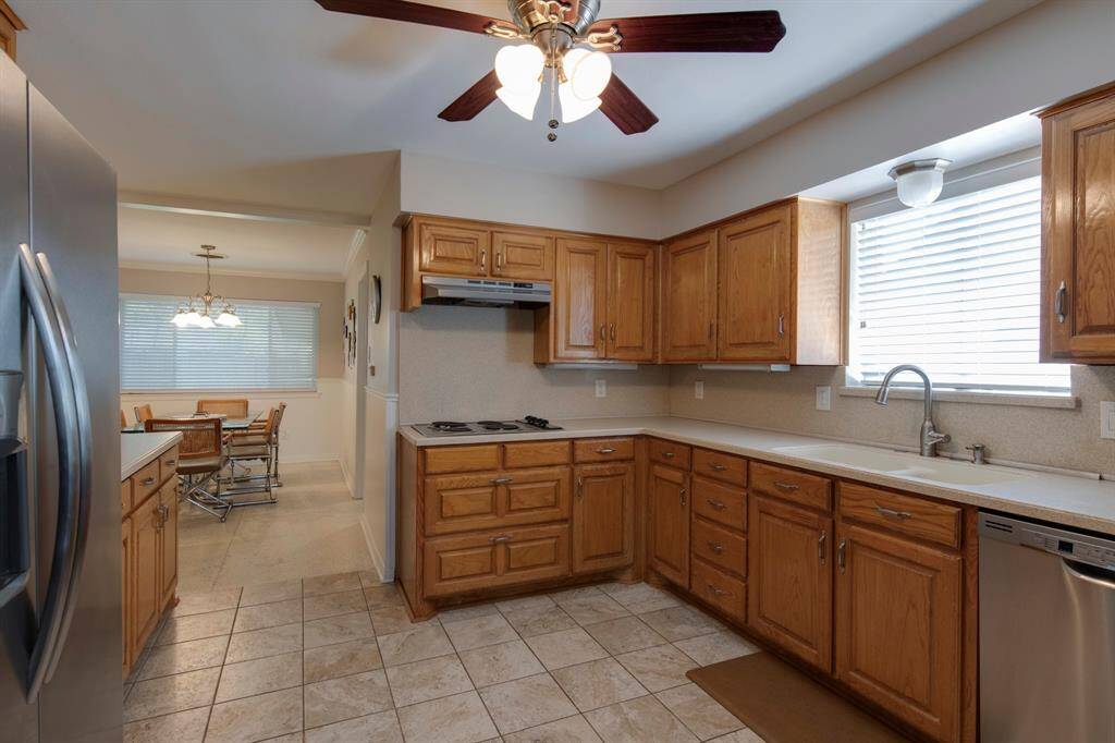 Large well laid out kitchen has plenty of counterspace and cabinet storage.