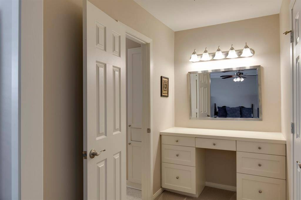 Vanity area off primary bath. Walk-in closet to the right.