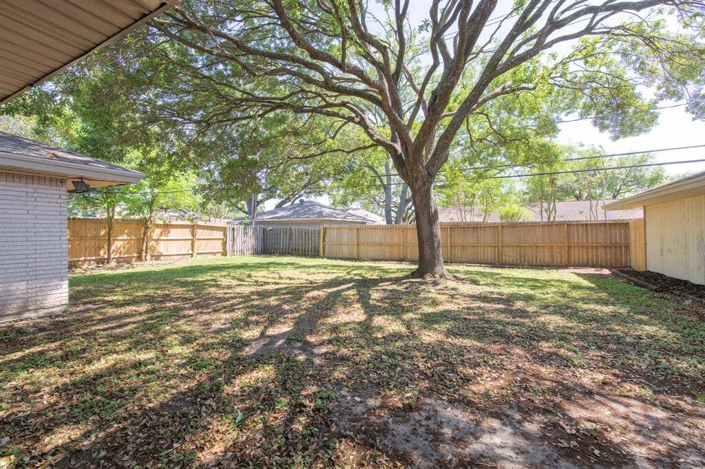 Large backyard with mature tree. Backyard still has plenty of room for a pool.
