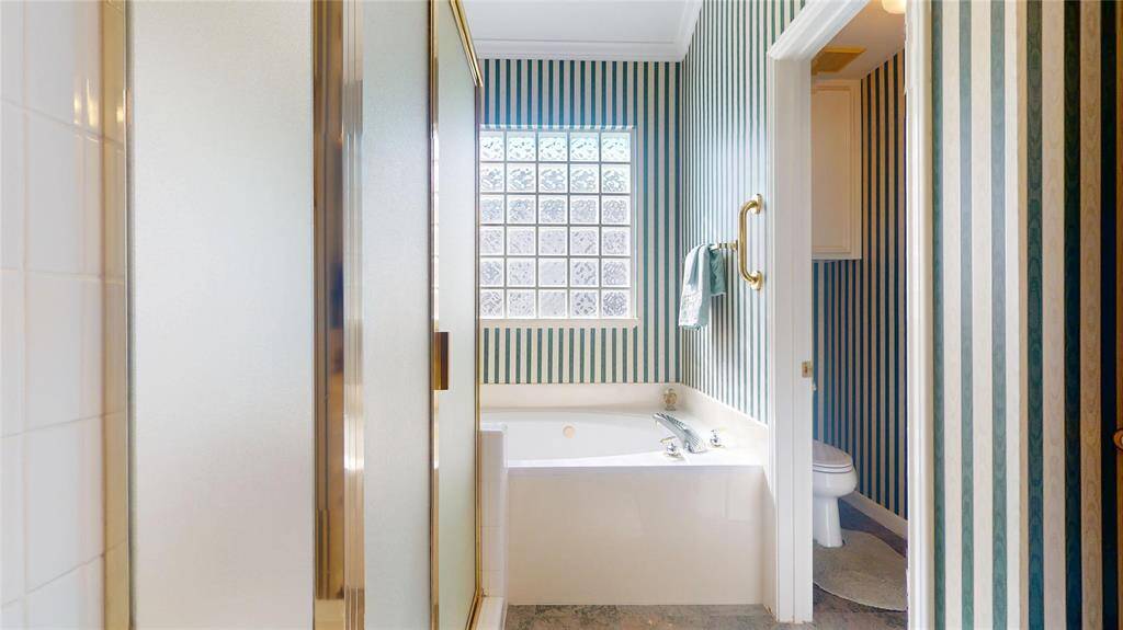En suite primary bath separate shower