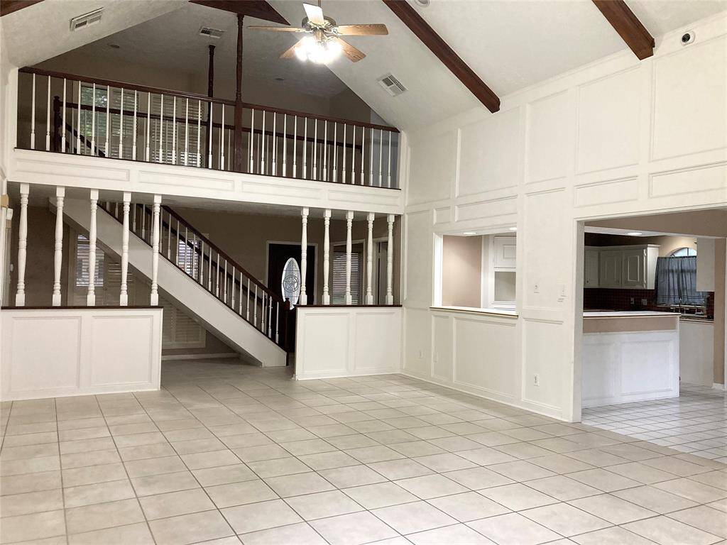 Massive living room with cathedral ceiling and fireplace.