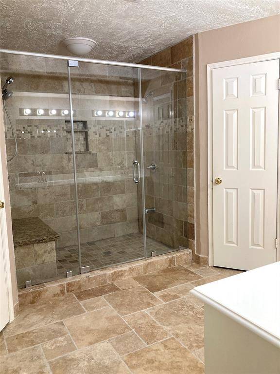 Primary bathroom with large walk-in shower.