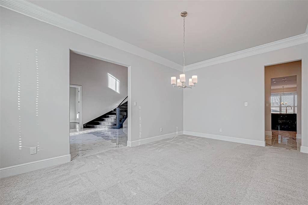 The formal dining room, with plush carpeting and direct access to the kitchen via a butler's pantry, is perfect for entertaining.