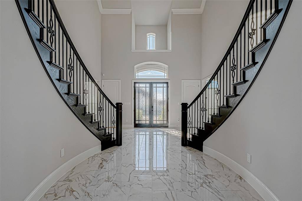 High ceilings and 8-foot doors throughout the home amplify the sense of openness, while abundant storage and closet space ensure functionality.