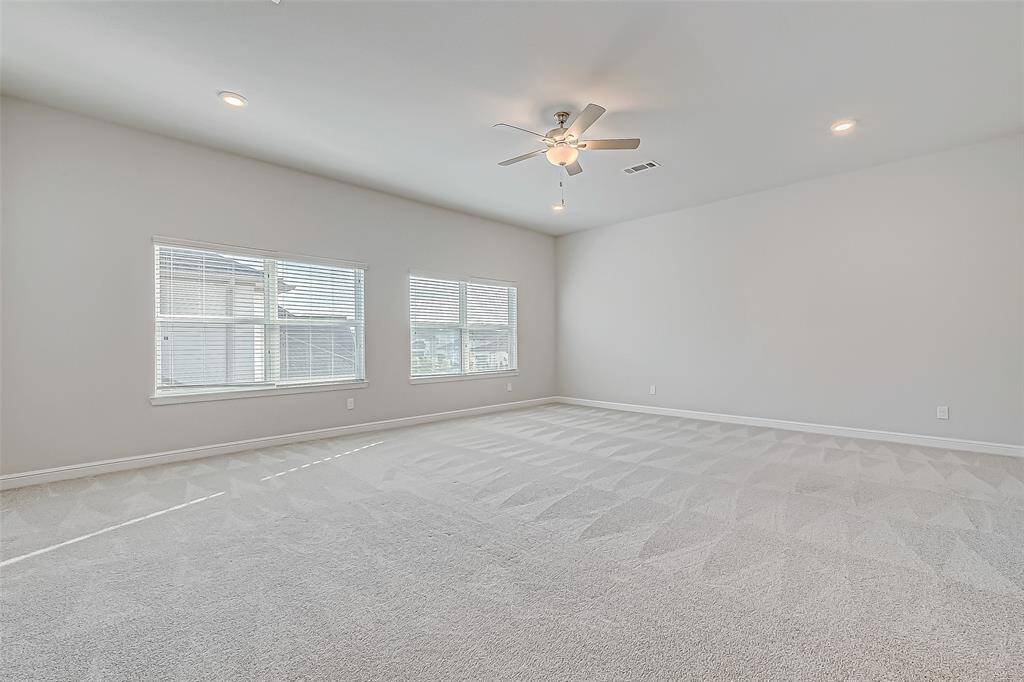 Game room with 2 large double windows.