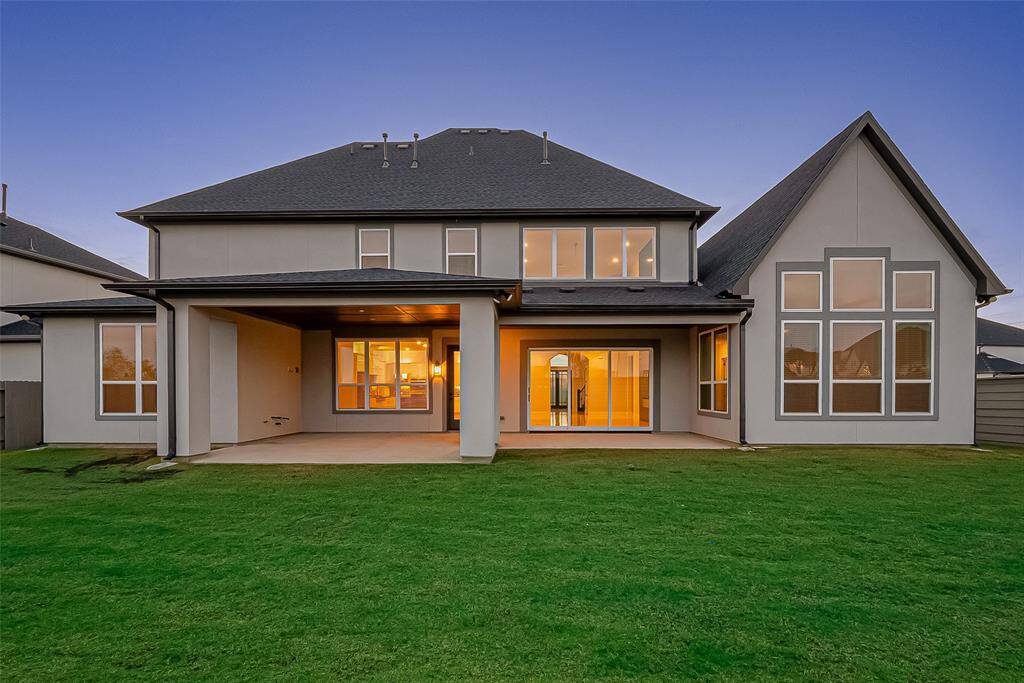 The expansive backyard is perfect for entertaining or personalizing with a pool, outdoor kitchen, or putting green. The extended covered patio features gas connections, making it ready for your future outdoor oasis.