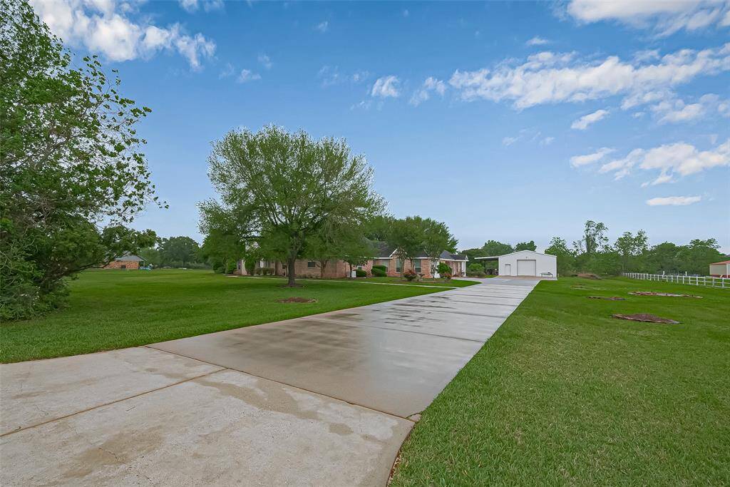 long driveway to accommodate plenty of parking for guests/equipment