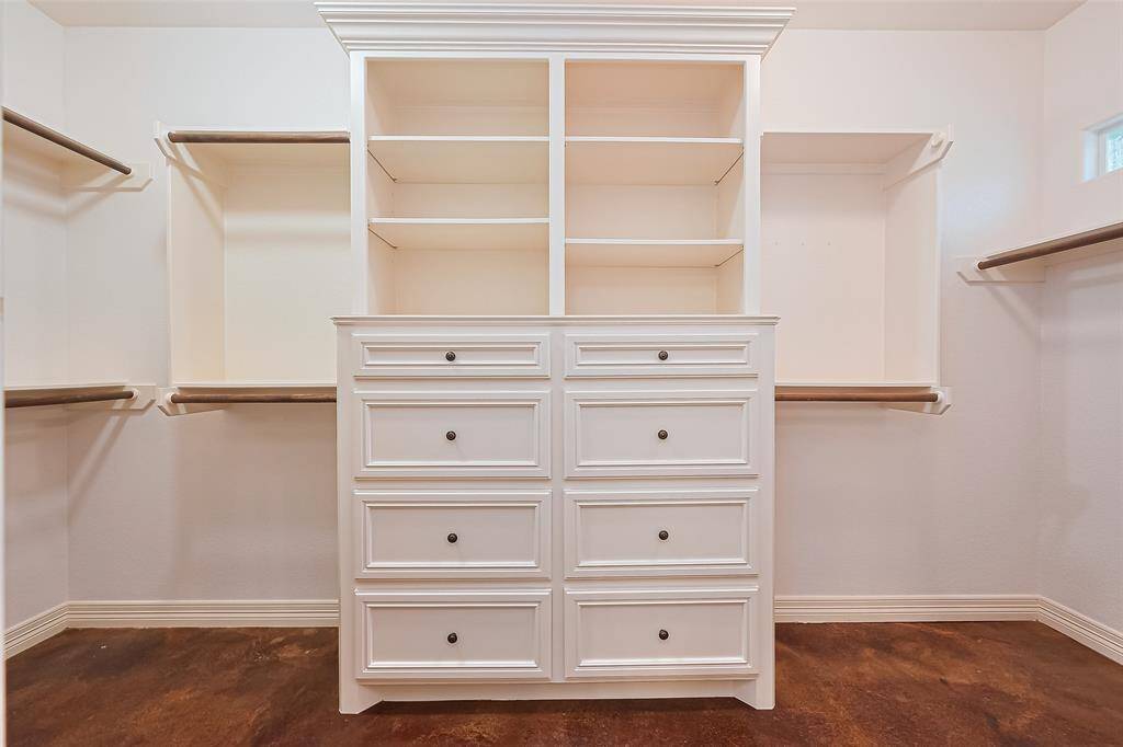 primary closet with custom built-ins