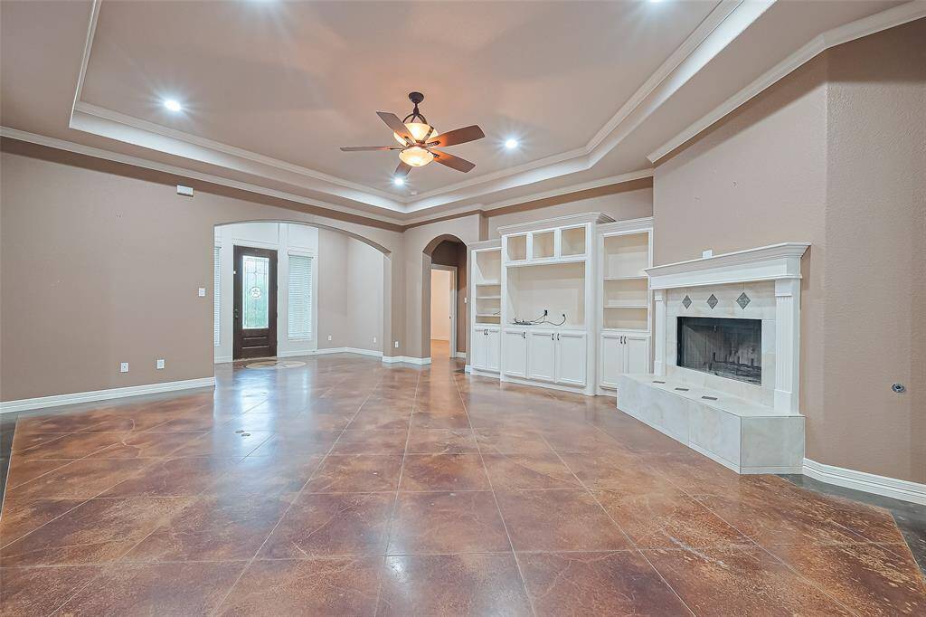 living area with built-ins and fireplace
