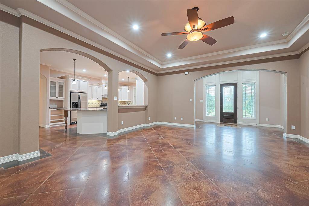 living opens to kitchen and dining