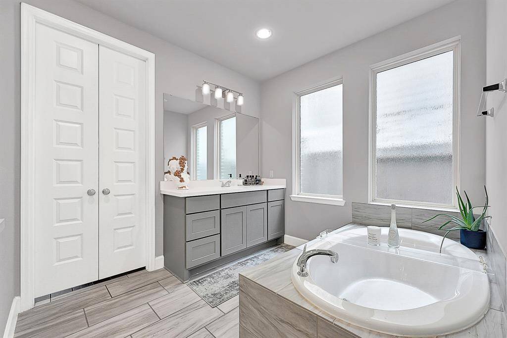Primary bathroom, tub and huge shower