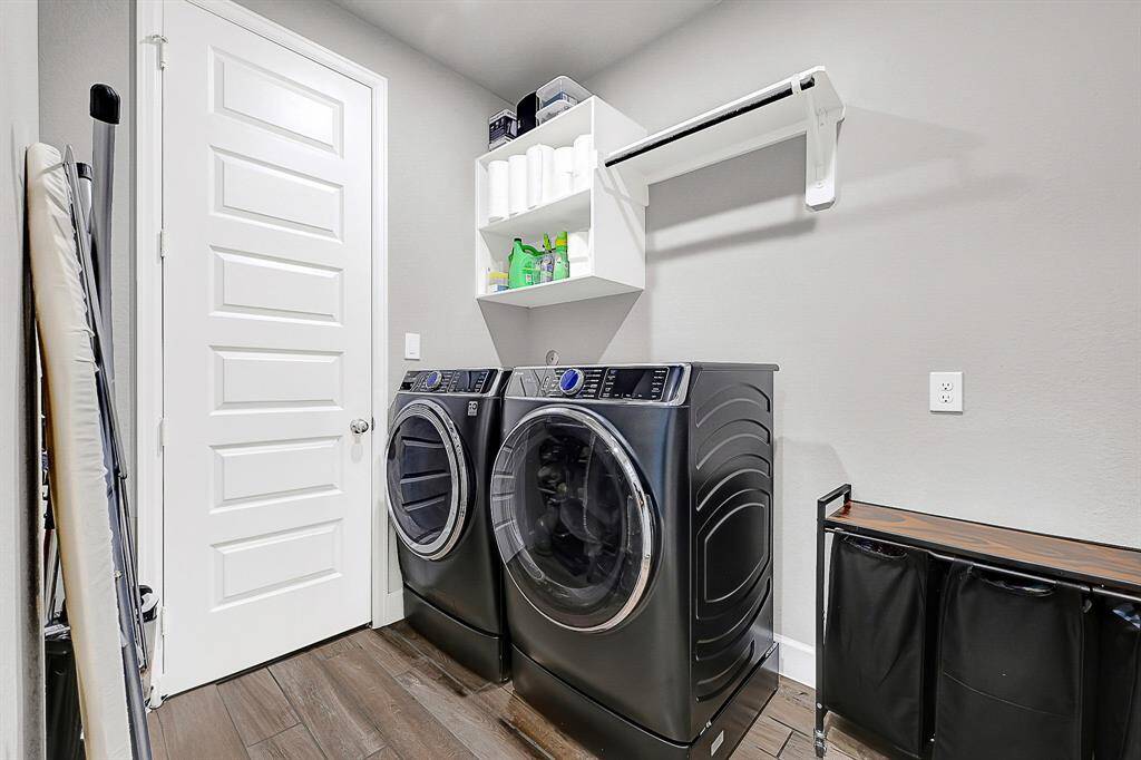 Laundry room with private access to primary bedroom