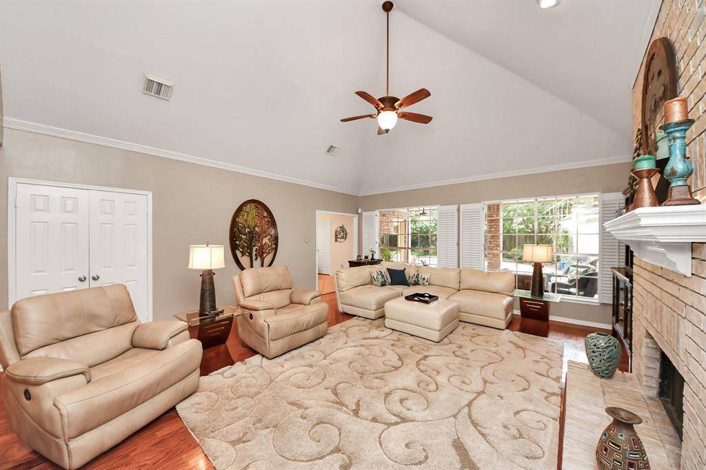 Adjacent to the kitchen, this area enhances effortless entertaining and fosters seamless family interaction, featuring a ceiling fan and elegant crown molding.
