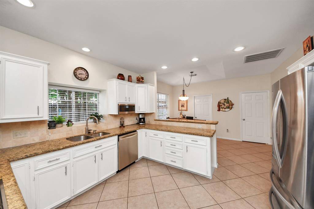 Doing dishes is made easier with a window by the sink, offering a pleasant view and sunshine while you work.