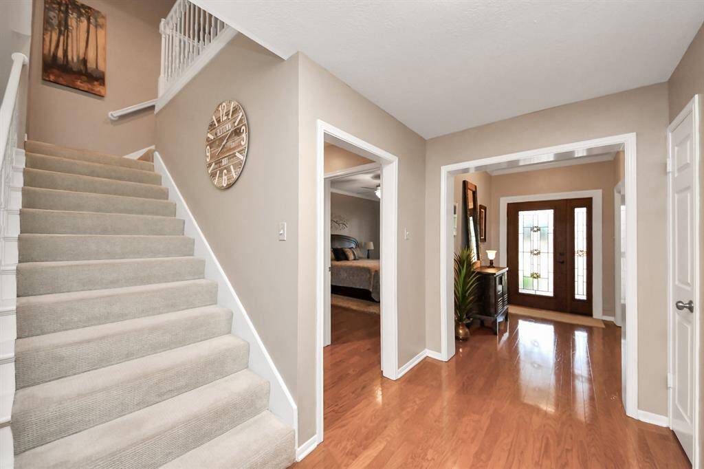 A staircase thoughtfully tucked away maximizes space, offering both functionality and a clean, streamlined design.