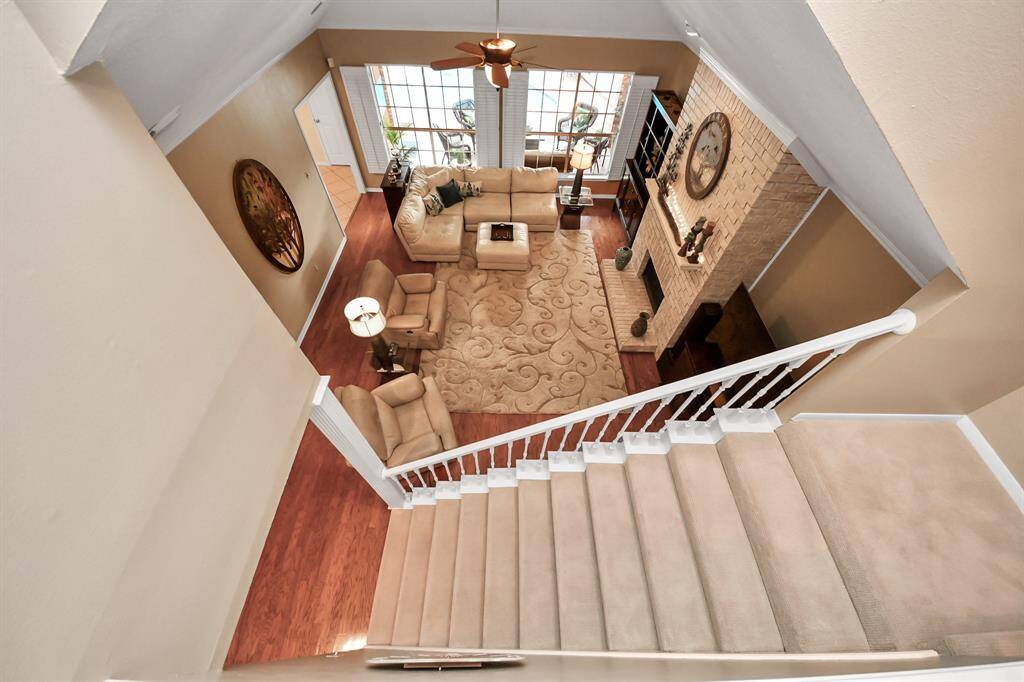 A view down into the den area highlights this incredible space, showcasing its expansive layout and inviting atmosphere.