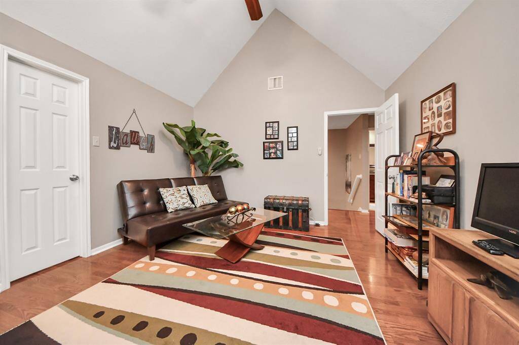High ceilings add a sense of dimension and openness to this room, enhancing its spacious feel. The third bedroom, currently utilized as a storage area, is just as spacious and accommodating as the first two, offering great potential for a variety of uses.
