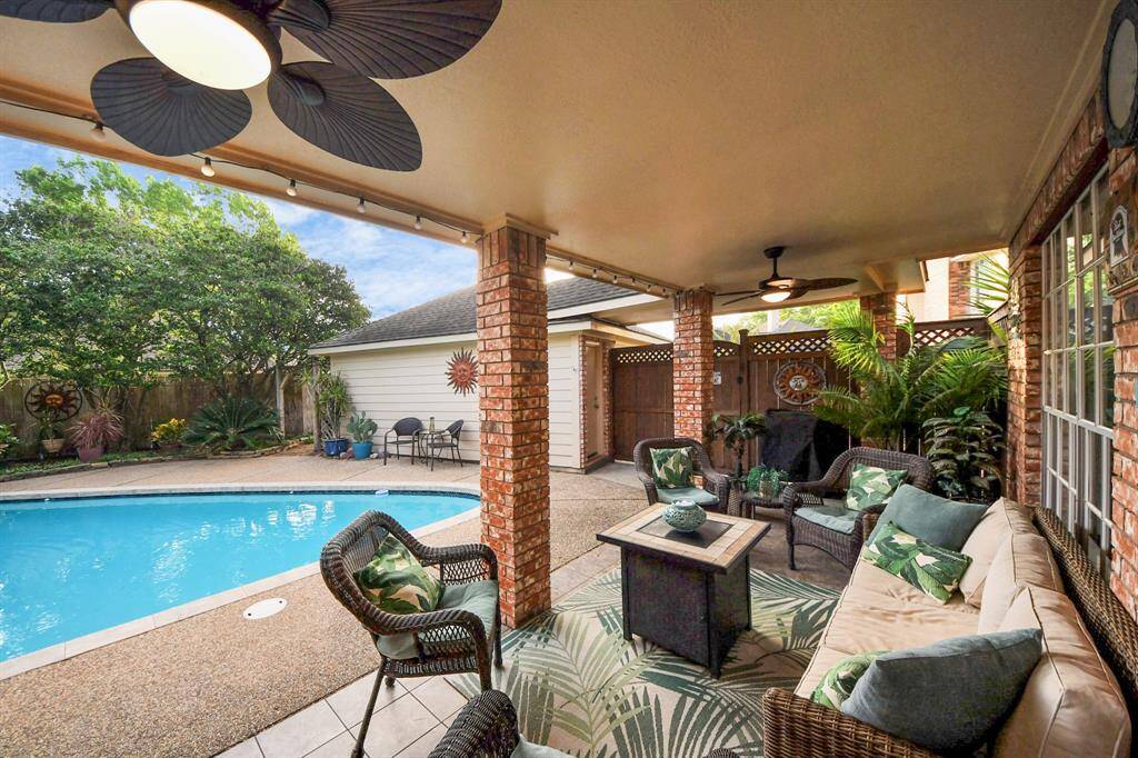 Step out onto your covered patio and immerse yourself in this oasis-like backyard, designed for relaxation and outdoor enjoyment.