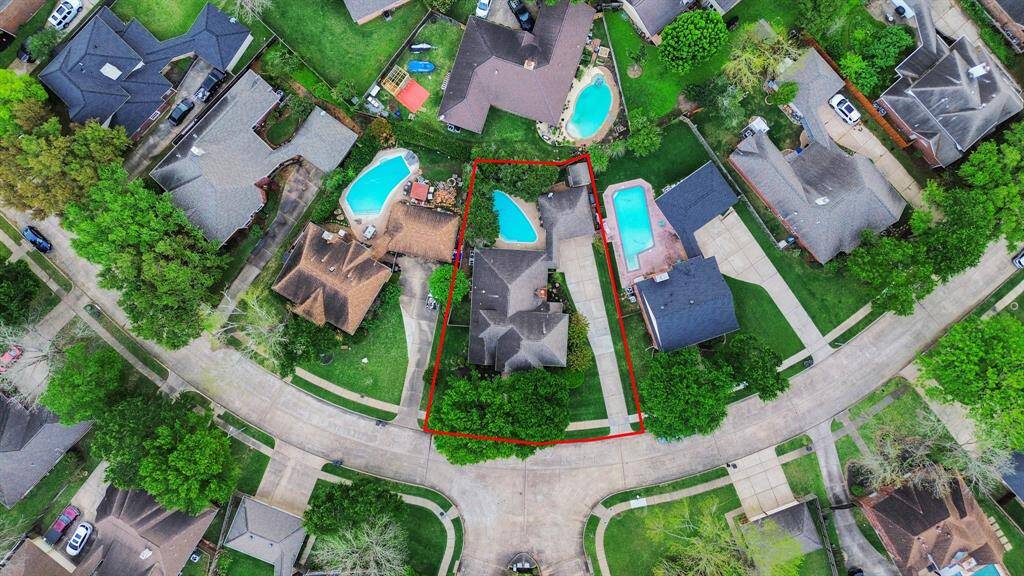 A bird's-eye view showcases the entire perimeter of the yard, highlighting the expansive outdoor space and its well-defined boundaries.
