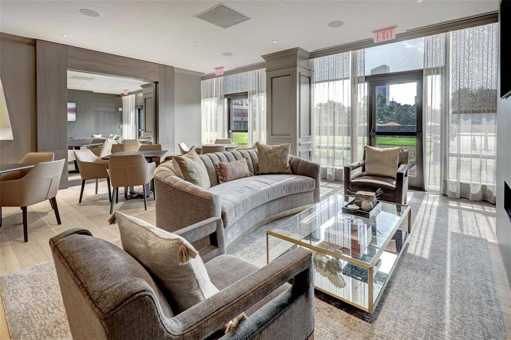 Lounging areas and card tables opening to the party room.