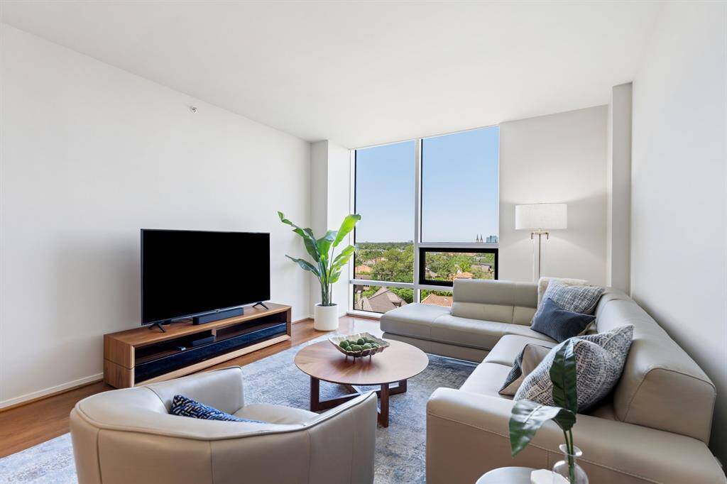 Floor to ceiling windows with automatic solar shades.