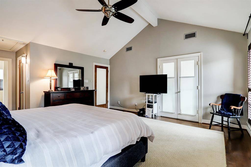 Another view of primary bedroom with on-suite bathroom.