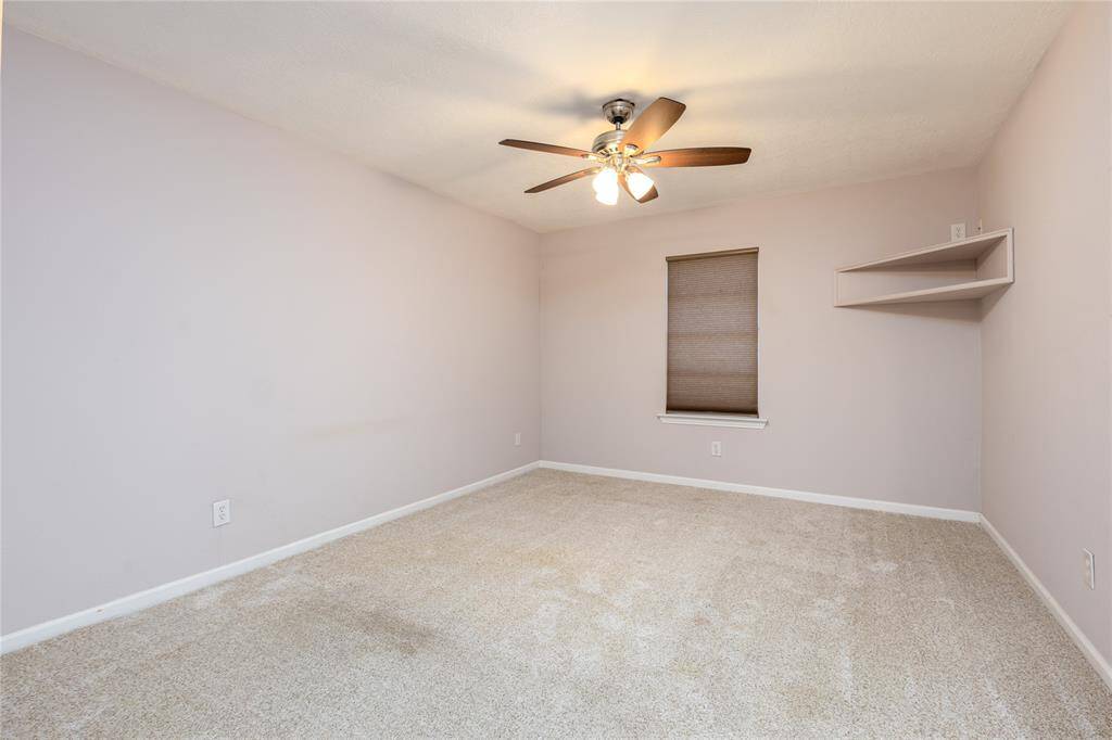 Main Bedroom has recent carpet and place to sit your TV or display your collectables.