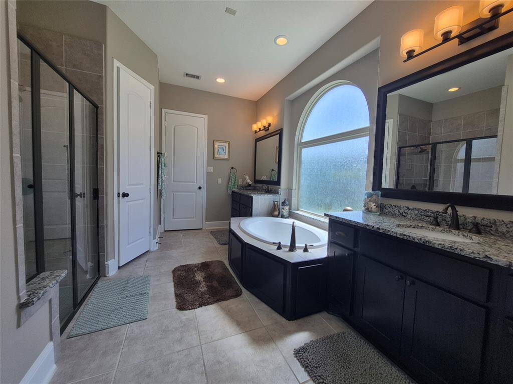 Main Bath- Soaking tub and separate sinks and shower