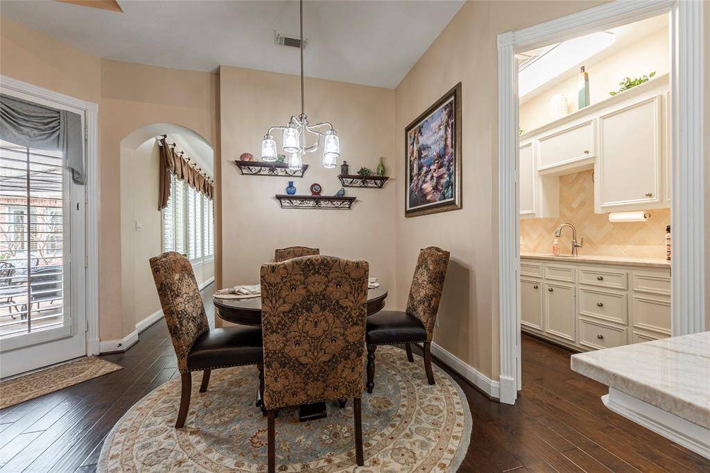 Cozy breakfast area located off the kitchen; perfectly placed furniture is negotiable throughout.