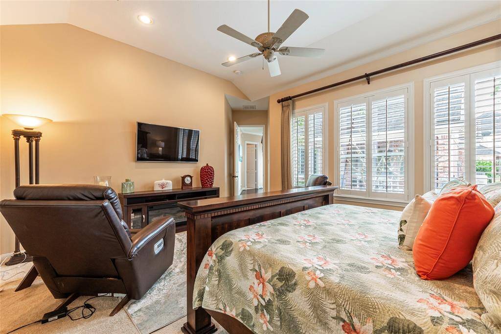 Another view of the spacious primary bedroom with recent carpet and paint.