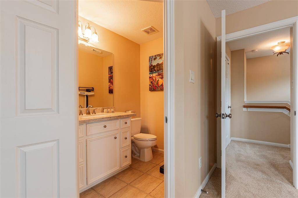View of the half-story layout upstairs with bedroom, half bath, closet.  Walk-in attic storage space with Radiant Attic barrier for energy efficiency.