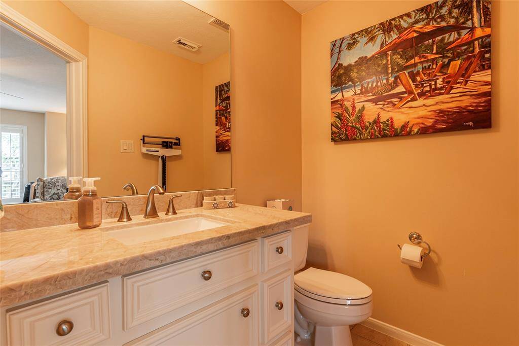 Updated half bathroom located upstairs off the 4th bedroom/flex room.