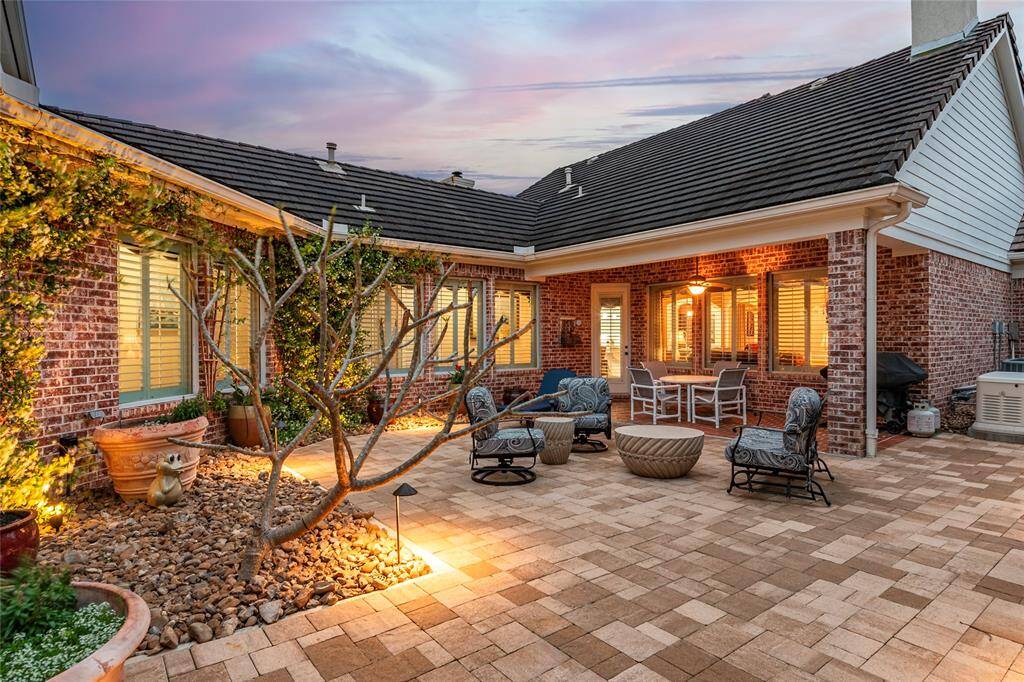 The perfect place to enjoy coastal breezes while sipping your morning coffee. The space features comfortable outdoor seating & decorative pavers with walkway.