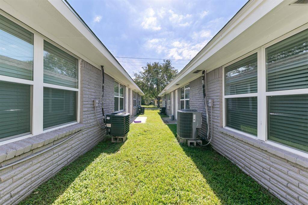 Enjoy a serene outdoor space at 716 Hargest St, Prairie View. This fourplex features well-maintained grounds between units, offering a peaceful setting.