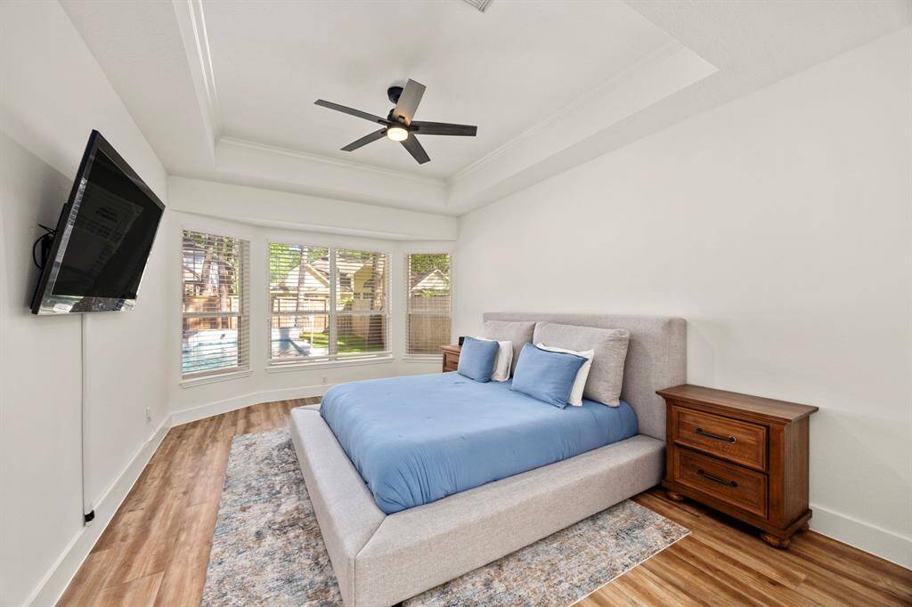 Primary bedroom downstairs that overlooks the pool