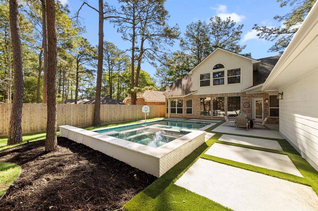 Turf around the pool with grass in the back of the yard for easy maintenance.