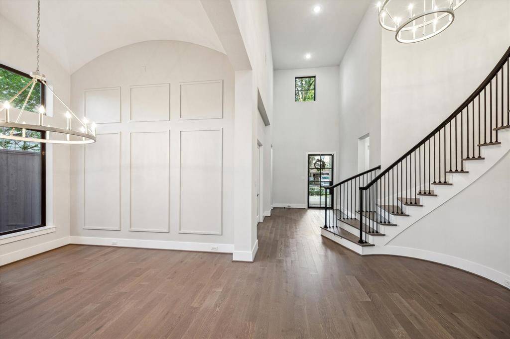 A laundry room with direct access to primary closet with sink and additional storage.